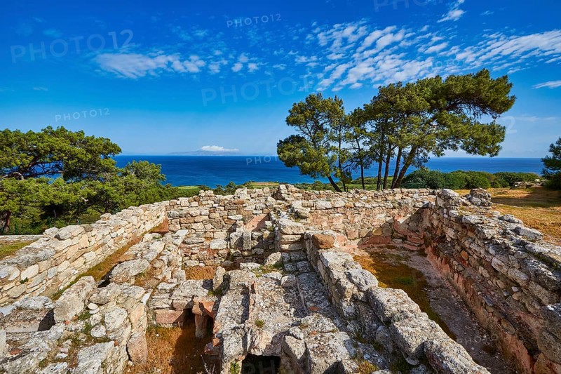 Ancient ruins with stone walls and views of the sea and trees under a blue sky, Kamiros, Archaeological site, Ancient city, Foundation of Doric Greeks, Rhodes, Dodecanese, Greek Islands, Greece, Europe