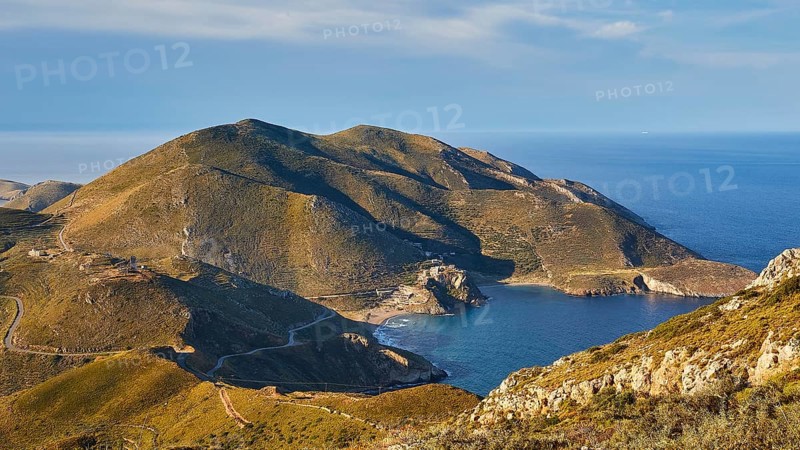 Sunny coastal road winding along a mountainous landscape overlooking the sea, southern tip, Mani Peninsula, Peloponnese, Greece, Europe