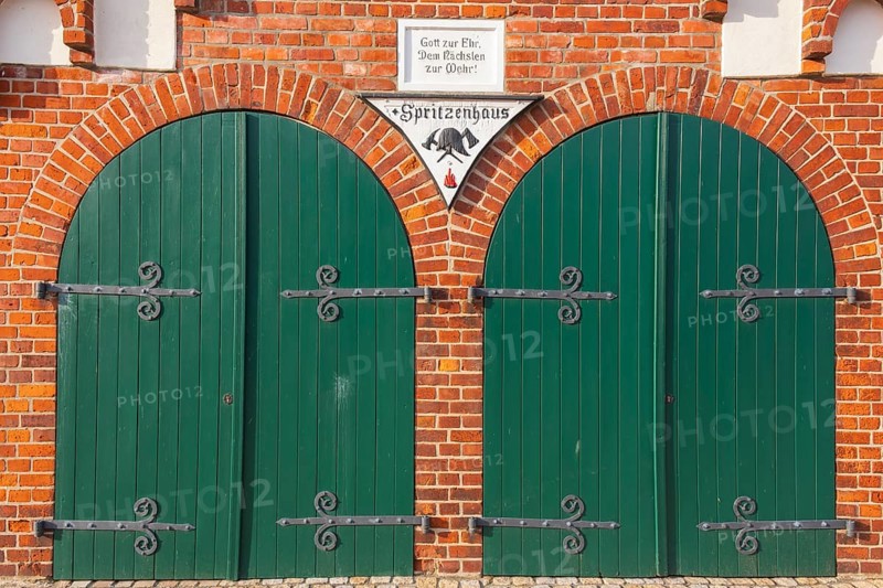 View of two green wooden gates of a fire station, Bücken, Hoya, Nienburg, Lower Saxony, Germany, Europe