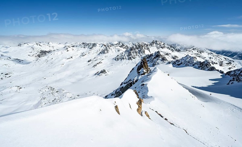 Mountain ridge of Piz Kesch, ascent on Piz Kesch or Piz d'Es-cha in winter, spectacular mountain landscape, view of mountain panorama with glacier Vadret da Porchabella, Albula Alps, Rhaetian Alps, Grisons, Eastern Switzerland, Switzerland, Europe