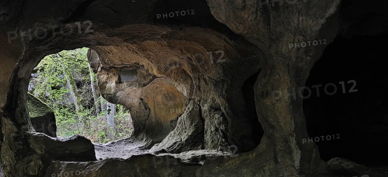The Hohllay cave showing grooves and circles in the sandstone rock from carving millstones, Berdorf, Little Switzerland, Mullerthal, Grand Duchy of Luxembourg