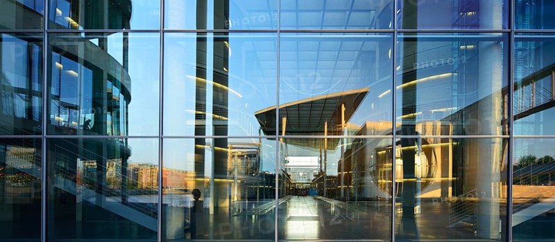 The Marie-Elisabeth-Lüders-Haus is reflected in the façade of the Paul-Löbe-Haus, functional building of the German Bundestag, government district, Berlin-Mitte, Berlin, Germany, Europe