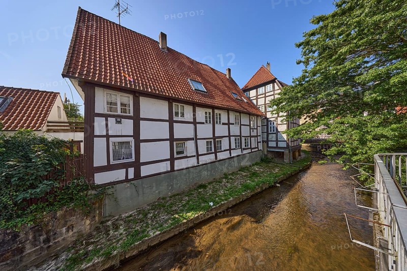 Half-timbered house against a cloudless blue sky on the Salze river in the city centre of Bad Salzuflen, Lippe district, North Rhine-Westphalia, Germany, Europe