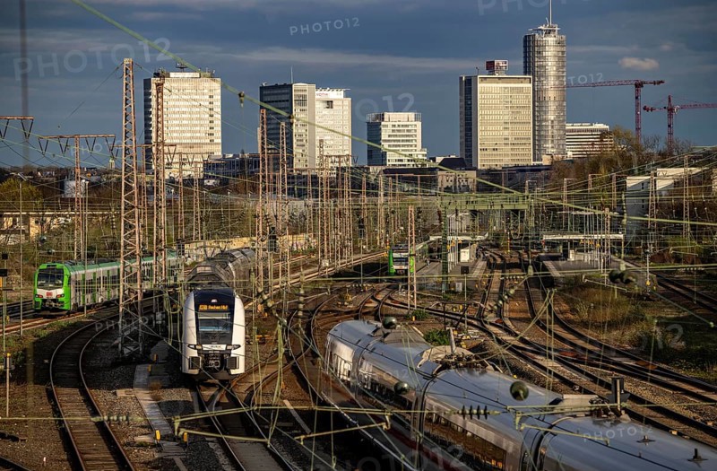 Train on the tracks west of Essen central station, city centre skyline, ICE and RRX, Rhine-Ruhr Express train, North Rhine-Westphalia, Germany, Europe