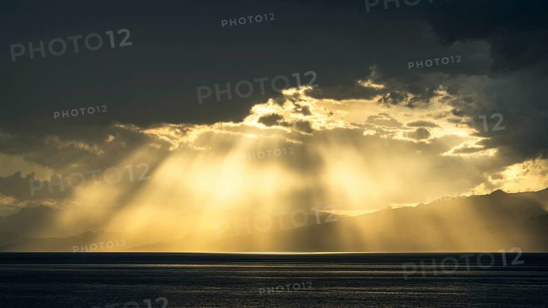 Sun rays in the clouds over Sicily, Tyrrhenian Sea, Italy, Europe