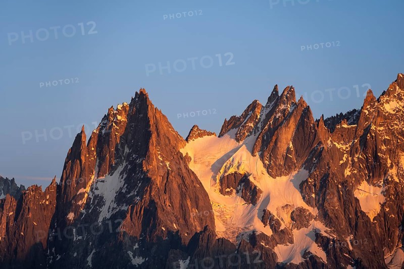 Rocky pointed mountain peaks at sunset, alpenglow, Aiguille du Plan, Mont Blanc massif, Chamonix, France, Europe