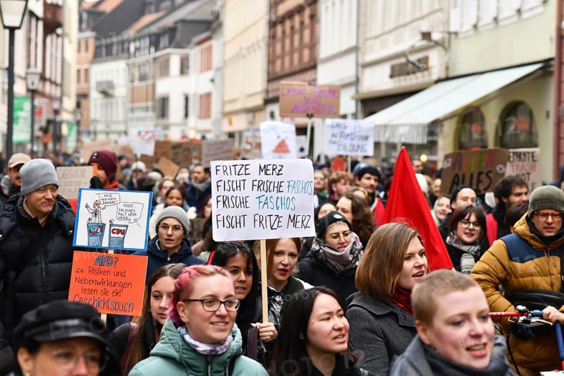 Heidelberg, Germany - February 12th 2025: Crowd of people with signs at protest against far-right