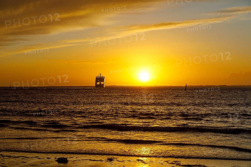Intense sunset on the west beach of Norderney, ferry, Lower Saxony, Germany, Europe