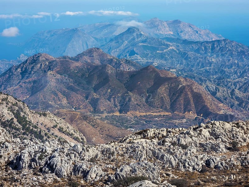 Deep view into the rough mountain and valley structure with blue and brown shades of northern Karpathos, hike to the summit of Kali Limni, Kali Limni, Lastos, Karpathos, Greece, Europe
