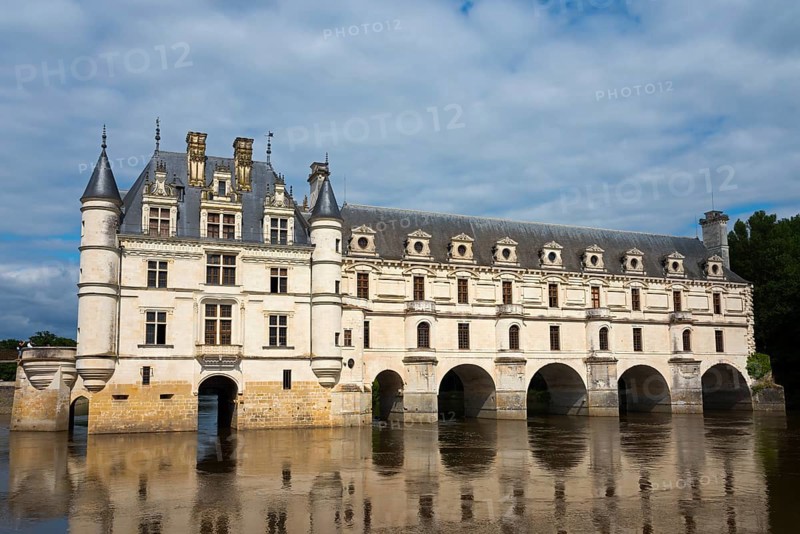Historic castle with towers and water reflection under a cloudy sky, Chenonceau Castle, Château de Chenonceau, moated castle, Cher River, Chenonceaux, Indre-et-Loire, Centre-Val de Loire, France, Europe