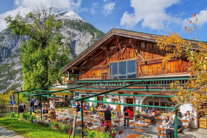 Landgasthof Ropferstubn with restaurant terrace overlooking the Inn Valley in front of the Hohe Munde 2662m, Telfs-Buchen near Seefeld, Tyrol, Austria, Europe