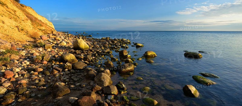 Cliffs and boulders on the coast of the Baltic Sea in the evening light, Reddevitzer Höft, Mönchgut peninsula, Rügen island, Mecklenburg-Western Pomerania, Germany, Europe