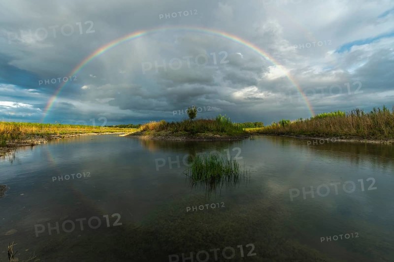 Large double rainbow after a spring storm. Bas-Rhin, Alsace, Grand Est, France, Europe