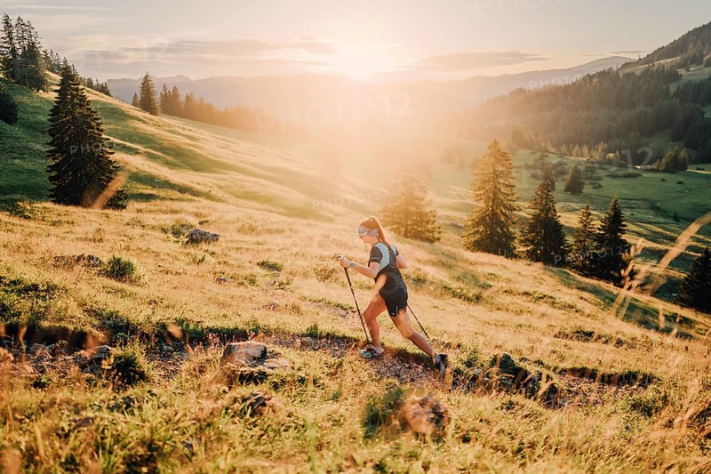 Summer trail running and hiking in the Alps on the Riedberg Pass between Obermaiselstein and Balderschwang in the Allgäu, Bavaria, Germany, Europe