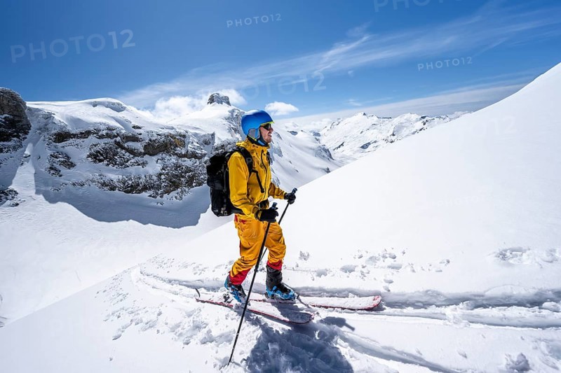 Ski tourer in mountain landscape with snow, ascent to Wildstrubelhütte, Bernese Alps, Switzerland, Europe