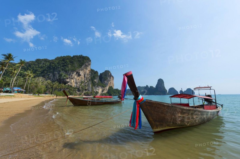 Longtail boat at Torsay beach for transporting tourists, water taxi, taxi boat, ferry, ferry boat, fishing boat, wooden boat, boat, decorated, tradition, cloth, colourful, fabric, decorated, superstition, traditional, bay, sea, ocean, Andaman Sea, tropics, tropical, chalk cliffs, landscape, island, water, travel, tourism, paradisiacal, beach holiday, sun, sunny, holiday, dream trip, holiday paradise, paradise, beach holiday, beach holiday, coastal landscape, nature, idyllic, Siam, exotic, travel photo, Krabi, Thailand, Asia