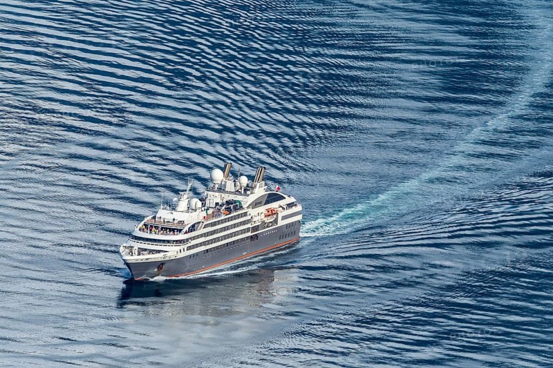 Cruise ship L'Austral leaving the Geirangerfjord into fjord Synnylvsfjord, seen from viewpoint at road 60 Hellesylt, Stranda, Sunnmøre region, Norway, Europe