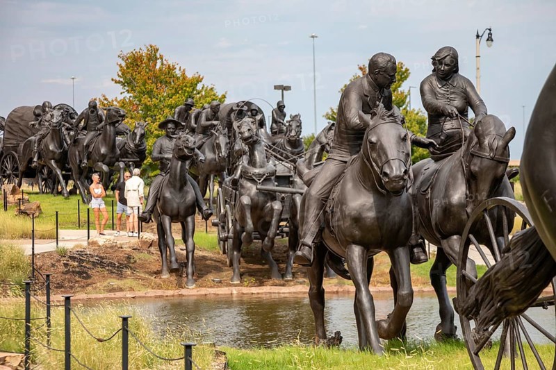Oklahoma City, Oklahoma - A sculpture commemorates the Oklahoma Land Run of 1889 when thousands of settlers were allowed to enter former Indian Territory and stake claims to the land. The sculpture, by artist Paul Moore, includes 45 figures stretching 365 feet along the Bricktown Canal.