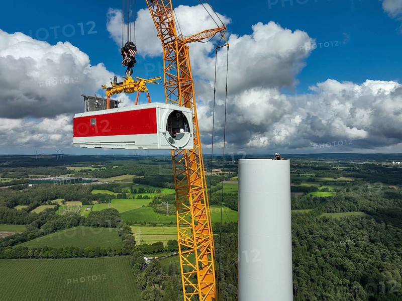Dorsten, North Rhine-Westphalia, Germany, construction of a wind turbine, the first wind turbine of the Große Heide wind farm. A large mobile crane places the nacelle, the nacelle on the tower, Europe