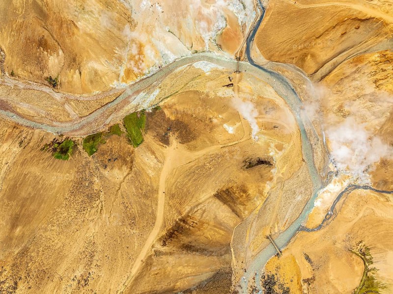 Steaming hot springs and colourful rhyolite mountains, aerial view, Hveradalir geothermal area, Kerlingarfjöll, Icelandic highlands, Iceland, Europe
