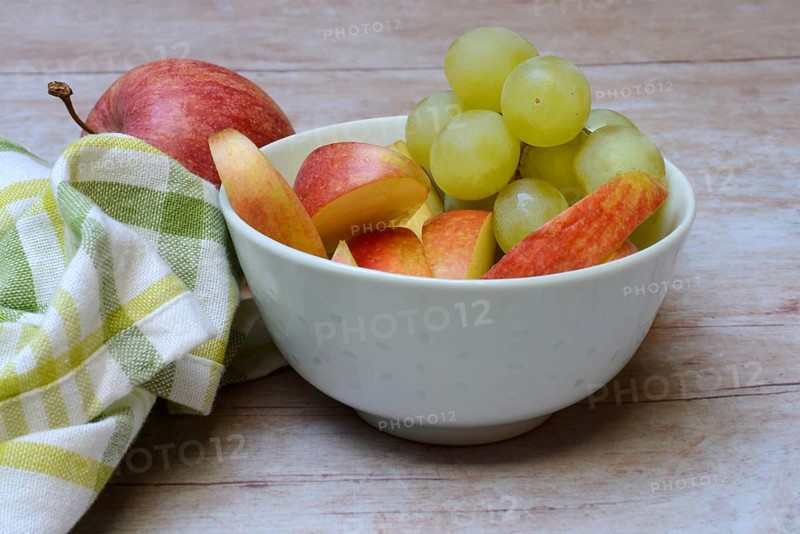 Apple slices and grapes in skin