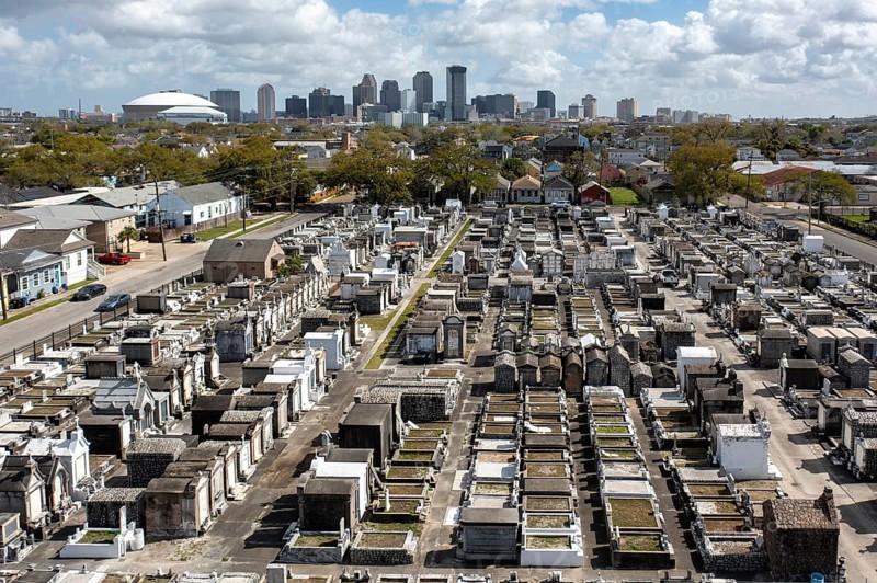 New Orleans, Louisiana - An aerial view of St. Joseph Cemetery #1, with the downtown skyline in the distance. Burial in New Orleans is generally above ground due to the city's high water table and its location below sea level