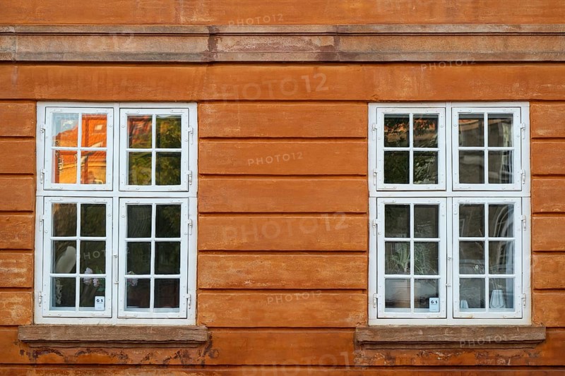 Windows with white frames, rust-red house, Frederiksholms Canal, Copenhagen, Denmark, Europe