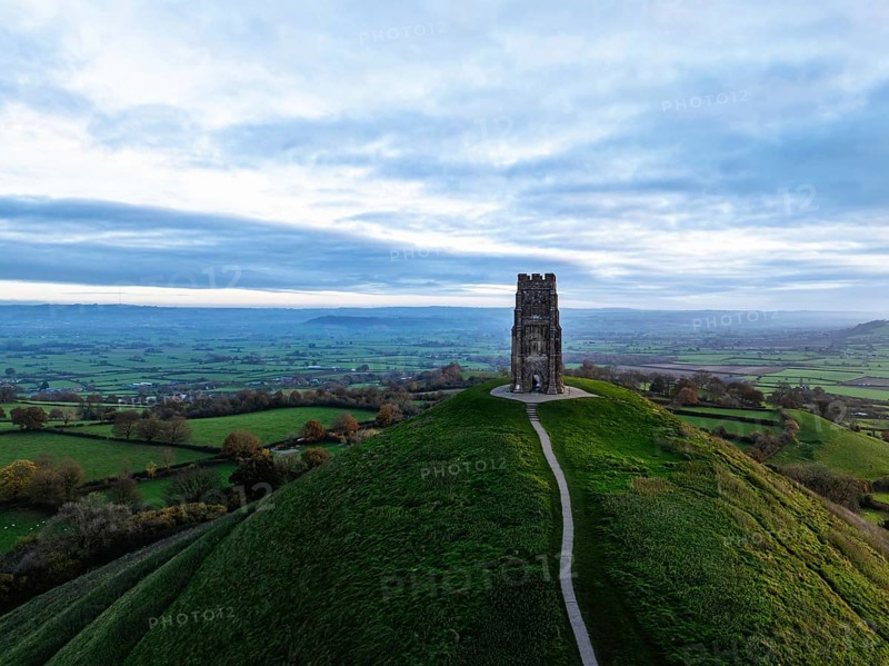 Sunrise over Glastonbury Tor from a drone at autumn, Glastonbury, Somerset, England, United Kingdom, Europe