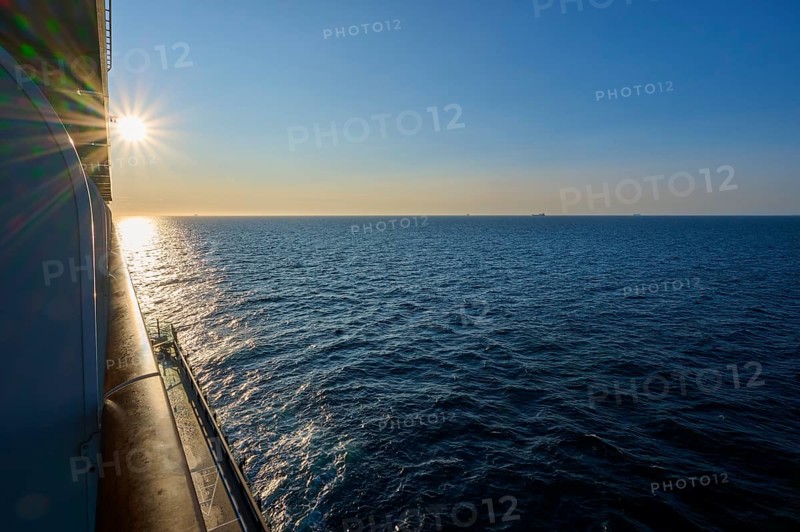 View from cruise ship, Mein Schiff 6, onto the wide sea at sunrise, under a clear blue sky, autumn, North Sea, Denmark, Europe
