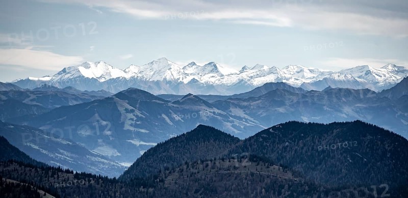 View of the Alpine foothills and main Alpine ridge with snow-covered peaks, summit of the Hohe Tauern with Großvenediger, from the Austrian Schinder, Bavarian Alps, Mangfall mountains, Bavaria, Germany, Europe