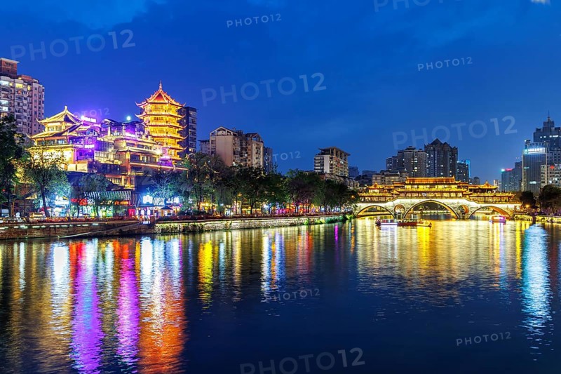 Chengdu Anshun Bridge over Jin River with pagoda at night in Chengdu, China, Asia