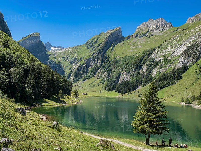 Lake Seealpsee, Alpstein mountain range near Wasserauen, peak of Mt. Säntis in the back, Appenzell, Switzerland, Europe