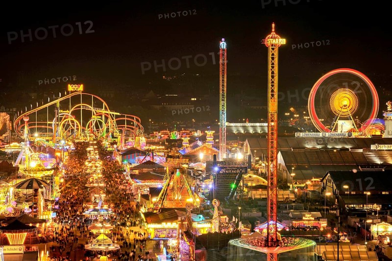 Street of beer tents, main street at night with illuminated roller coaster, Ferris wheel, stalls, beer tents, Oktoberfest, Wiesn, Wies'n, Munich, Upper Bavaria, Bavaria, Germany, Europe
