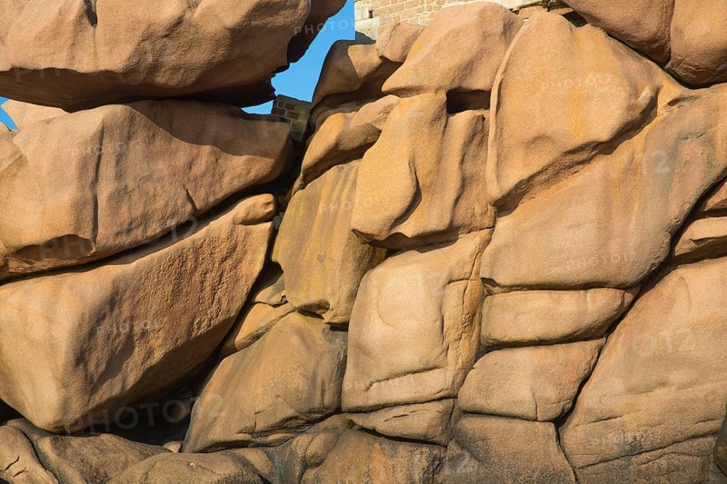 A face in stones. Lighthouse Mean Ruz at Ploumanach, Cotes d'Armor in the last evening light
