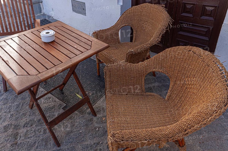 Table and chairs in the outdoor catering area, Vejer, Andalusia, Spain, Europe