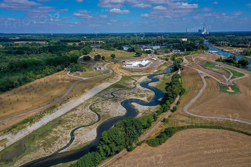 Recklinghausen, Castrop-Rauxel, North Rhine-Westphalia, Germany, EMSCHERLAND construction project, a 37-hectare water and nature discovery park at the water crossroads of the Rhine-Herne Canal (right) and the renaturalised Emscher (centre) on the city limits of Recklinghausen and Castrop-Rauxel. The ecological focus at the confluence of Suderwicher Bach (left) and Emscher (centre) will also be a future garden for the International Garden Exhibition 2027. Before the renaturation, the Emscher river system was an open, above-ground wastewater canal, combined sewer with surface water and wastewater. The Uniper power plant Datteln 4 in the background, Europe