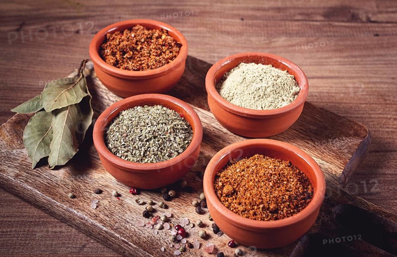Georgian spices, in ceramic bowls, assortment, set of spices, utsho, adjika, Svan salt, ground coriander, top view, no people