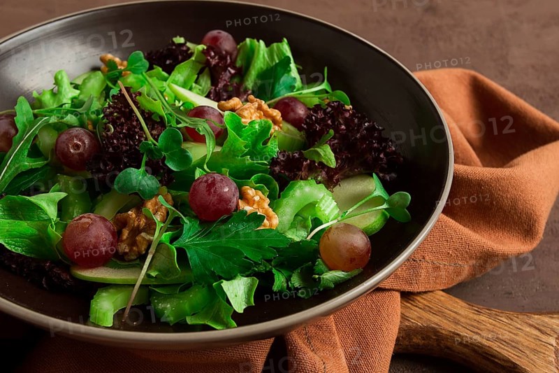 Fresh salad, waldorf, celery stalk, with apple and walnut, grapes, herbs, homemade, no people