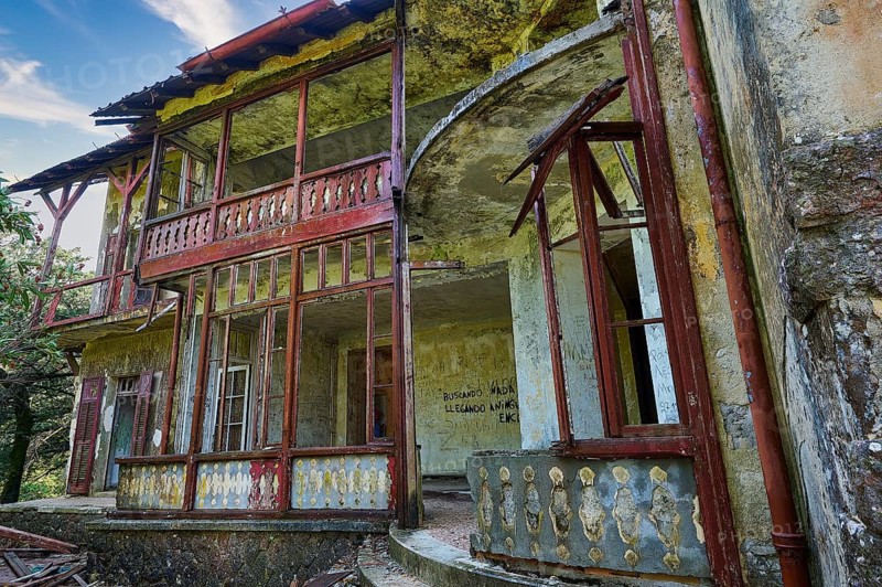 Sky replaced, Abandoned, dilapidated building with red doors and rusty railings, graffiti on the walls and dilapidated structures, Mussolini Villa, Villa de Vecchi, Profitis Ilias, Empona, Rhodes, Dodecanese, Greek Islands, Greece, Europe