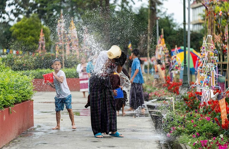 NAMSAI, INDIA.- APRIL 16: Devotees celebrate the vibrant Sangken Festival by pouring water over each other at Golden Pagoda in Namsai, India on 16 April 2025. Sangken Festival is a beautiful and culturally rich water festival celebrated primarily by the Theravada Buddhist communities, it marks the Buddhist New Year, typically falling in mid-April