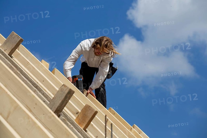 Carpenters working on the roof of a new building in the Rhein-Pfalz district