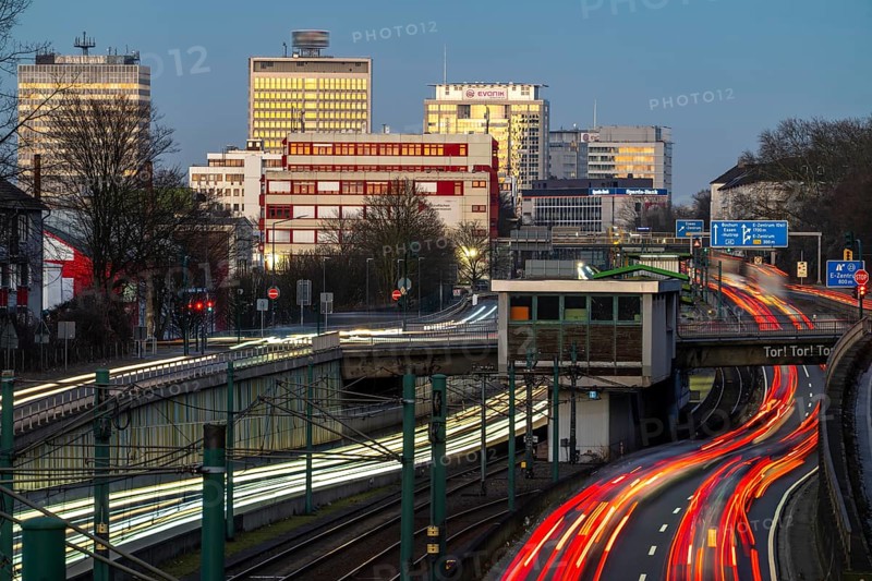 Motorway A40, Ruhr expressway, heavy traffic jam, rush hour, city passage in Essen, skyline of the city centre, underground line between the lanes, Hobeisenbrücke stop, North Rhine-Westphalia, Germany, Europe