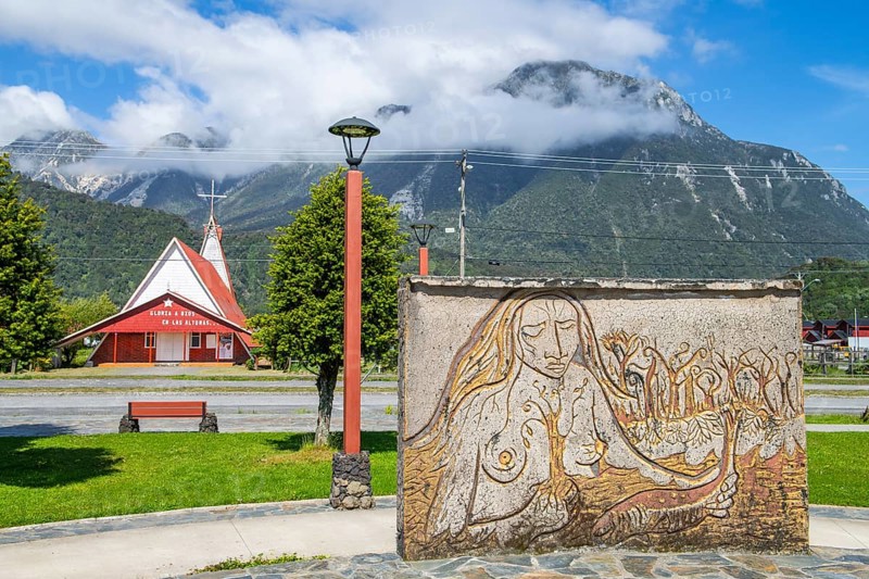 Relief of an indigenous woman and church in the village of Chaiten, Pumalin-Douglas Tompkins National Park, Chaiten, Los Lagos region, Patagonia, Chile, South America