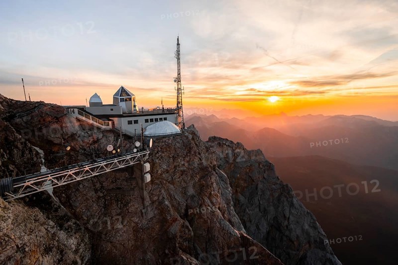 Mountain station of the Tyrolean Zugspitze railway at the summit of the Zugspitze, at sunset, Wetterstein Mountains, Northern Limestone Alps, Bavaria, Germany, Europe