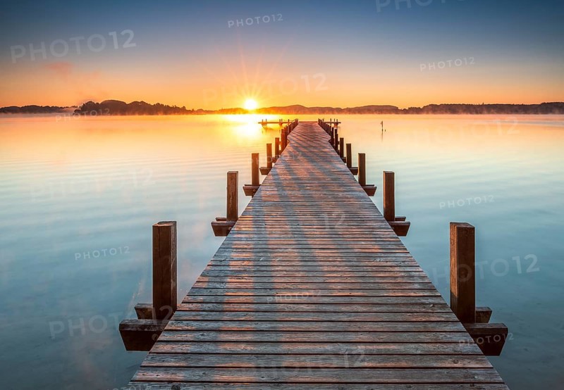 Jetty at Wörthsee at sunrise, fog on the water, Bavaria, Germany, Europe