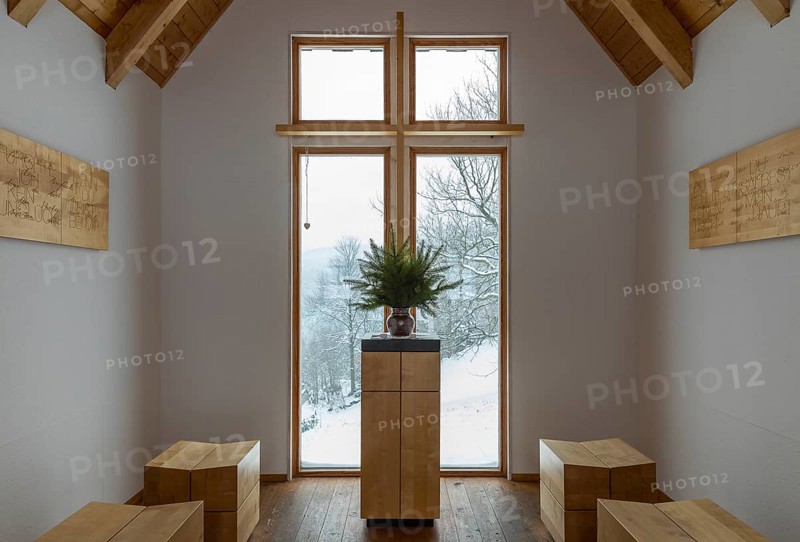 Interior of the chapel on the Glockenwanderweg trail with simple altar and small wooden benches, Oberlochmühle, Deutschneudorf, Erzgebirge, Saxony, Germany, Europe