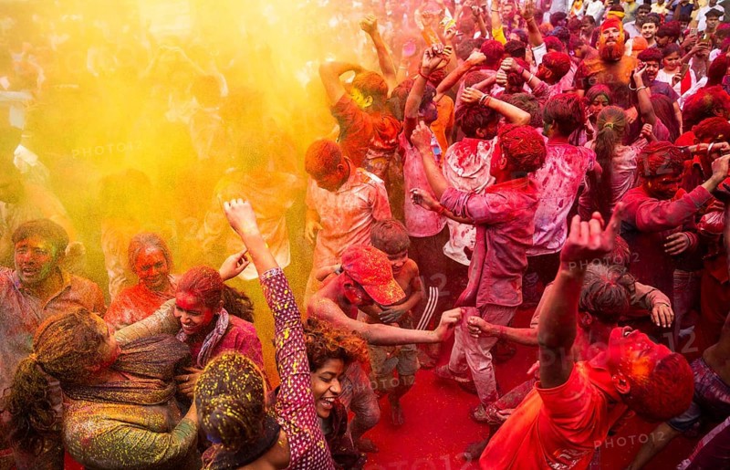 Revellers smear with Gulal or coloured powder and dance to play Holi, the Hindu spring festival of colours, on March 14, 2025 in Guwahati, India, Asia