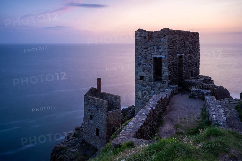 The ruins of the Crowns Engine Houses of the Botallack Mine, also known as the Crown Mine. In the evening, after sunset. Long exposure. Botallack, Penzance, Cornwall, England, Great Britain
