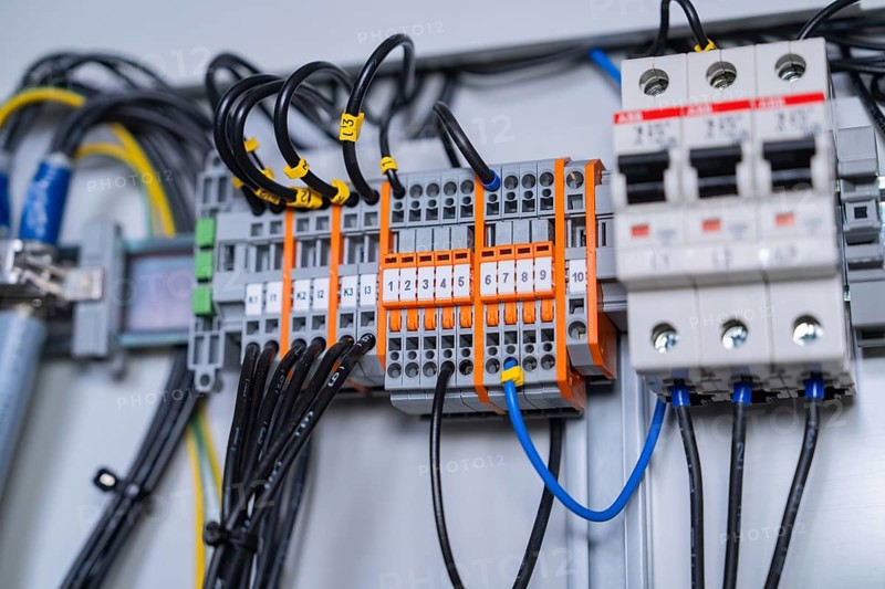 Close-up of wired circuit-breakers, showing technical accuracy and functional arrangement of components, switch cabinet construction, PV system construction, major customers, Enzkreis, Germany, Europe