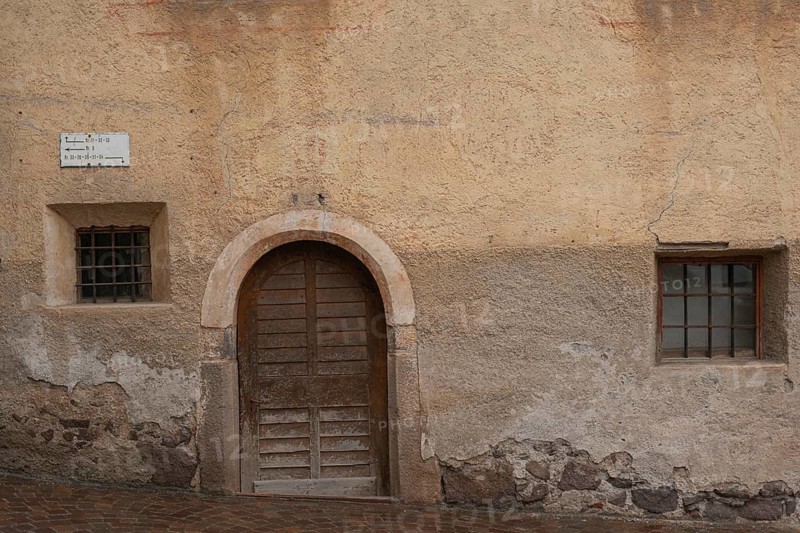 View of a wooden door and window of an old building, St.Peter, Villnöß, Funes, Villnößtal, South Tyrol, Italy, Europe